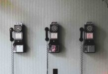 telephones hanging from a wall