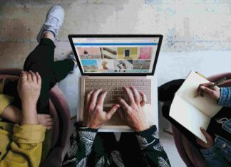 person typing on computer