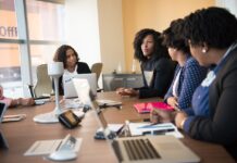 Open communication with people around a conference table