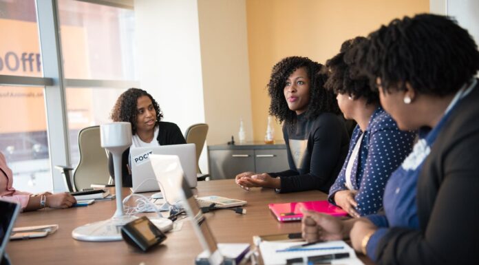 Open communication with people around a conference table